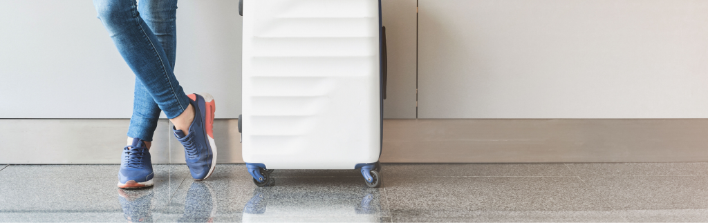 Photo of white suitcase at airport
