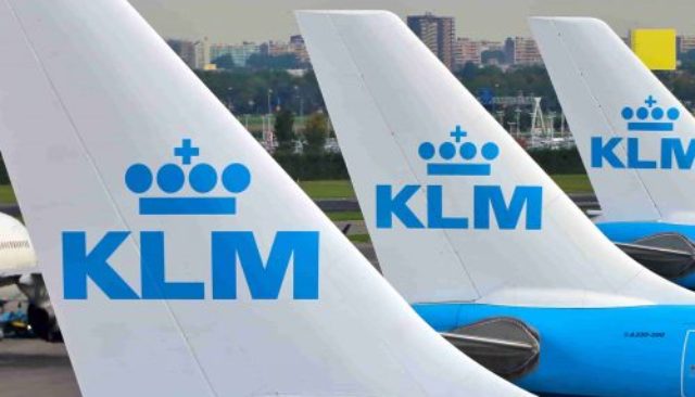KLM airplanes lined up at the airport