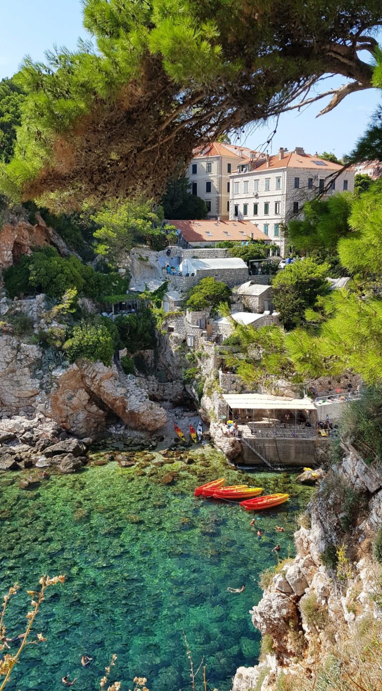 A scenic view of a lake town with clear blue water