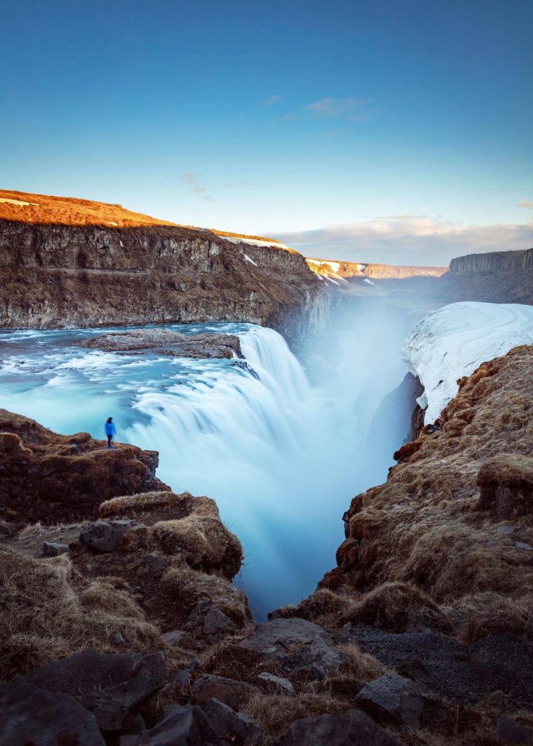 A scenic view of a waterfall in Iceland