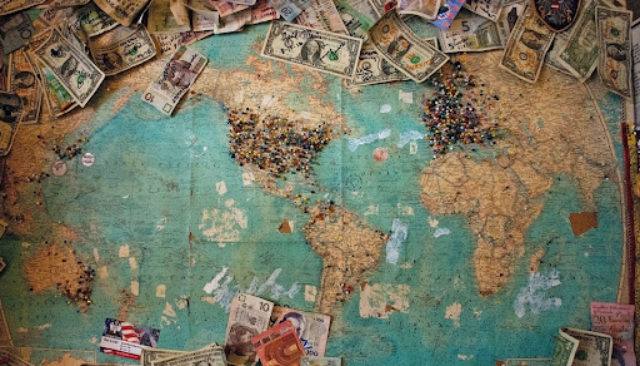 cash money spread on world map